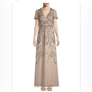 Aidan Mattox beaded V neck with Cap sleeve beaded gown.